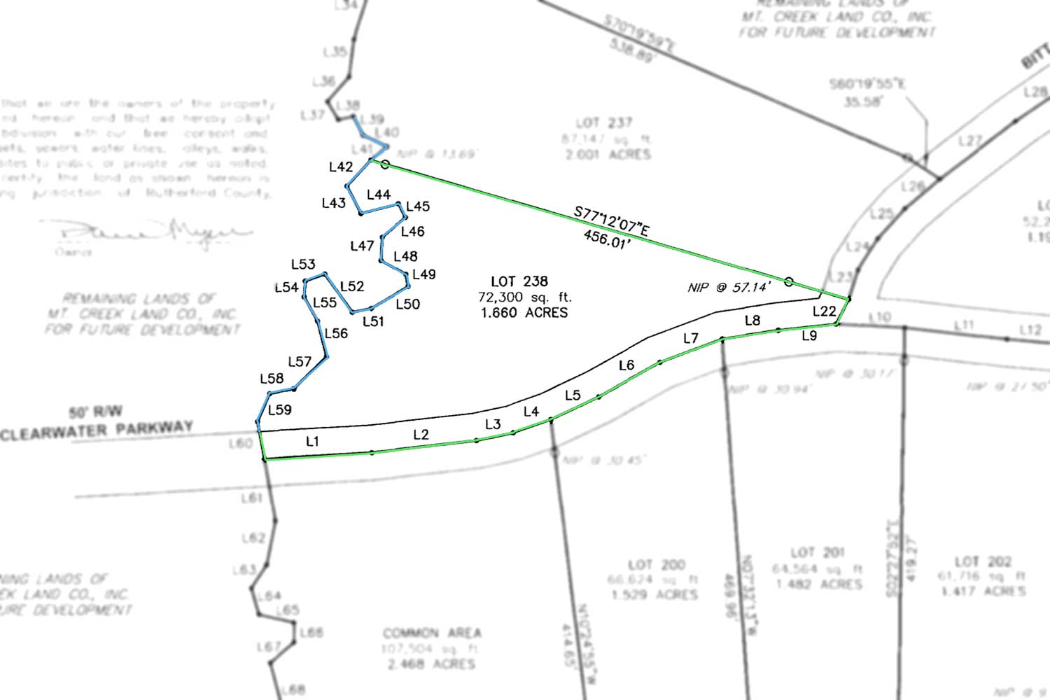 MLS  4415238, wooded, sloping land with stream frontage in Clearwater Creek
