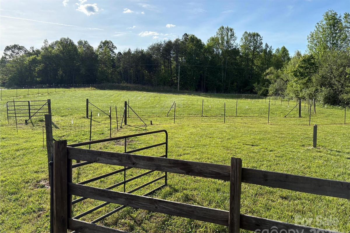 17 acres of pasture, creek, stables, barn, garage, and large 4,579 sq ft home