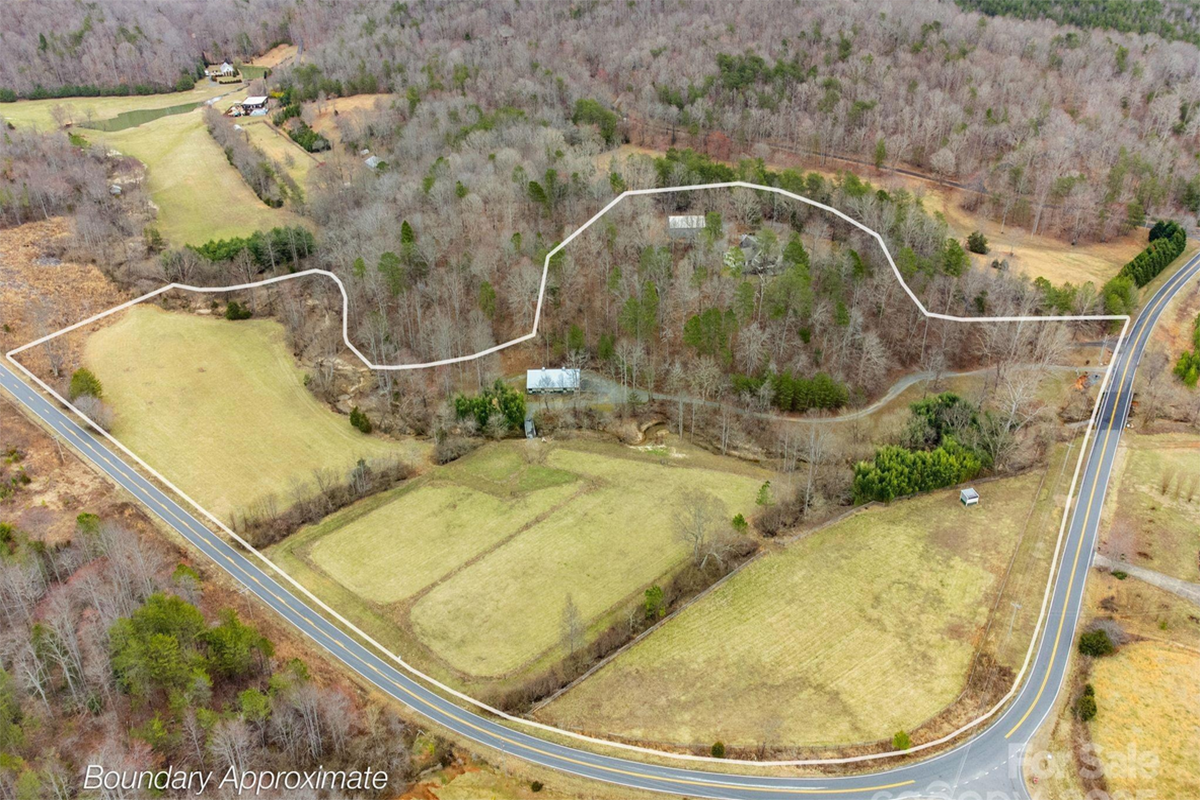 17 acres of pasture, creek, stables, barn, garage, and large 4,579 sq ft home