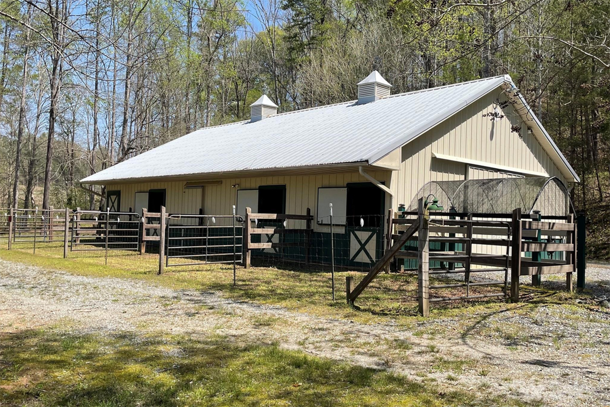 17 acres of pasture, creek, stables, barn, garage, and large 4,579 sq ft home